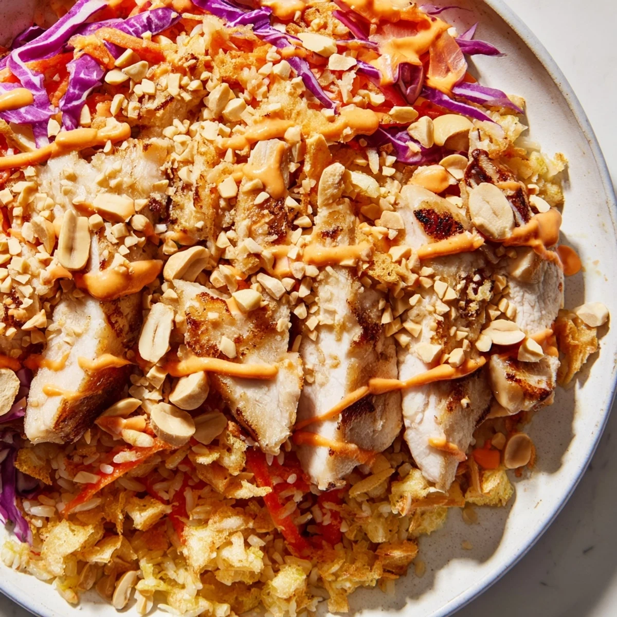Crispy golden rice and tender sliced chicken topped with creamy spicy Bang Bang sauce
