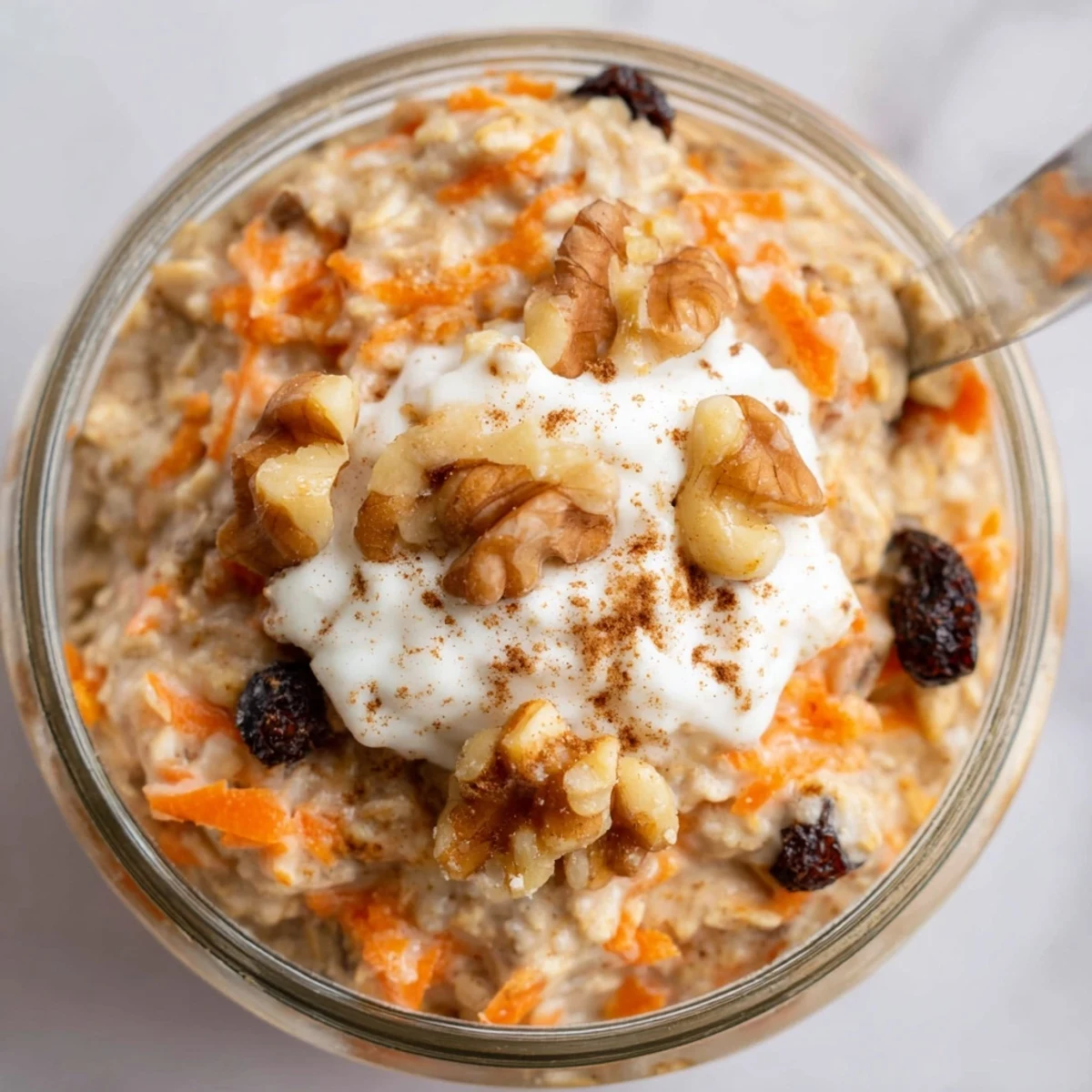 Spiced carrot cake overnight oats served chilled with a drizzle of maple syrup