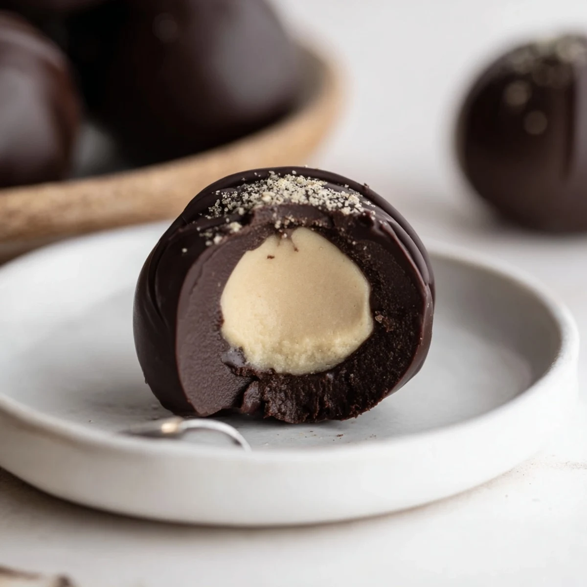 Dark Chocolate Eggnog Truffles glistening with glossy shells, dusted nutmeg, holiday gift