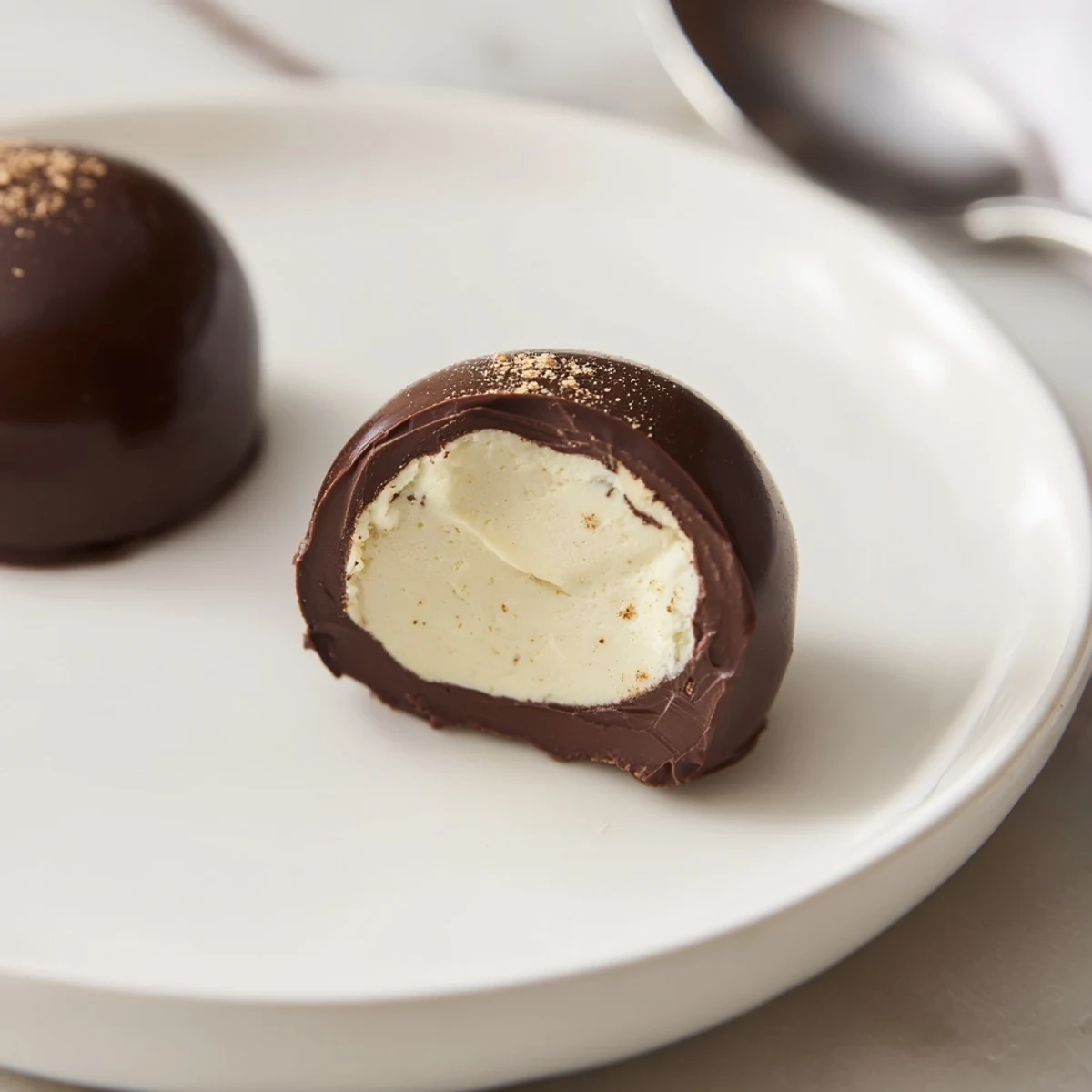 Nutmeg-scented Dark Chocolate Eggnog Truffles cooling on parchment, ready to dip