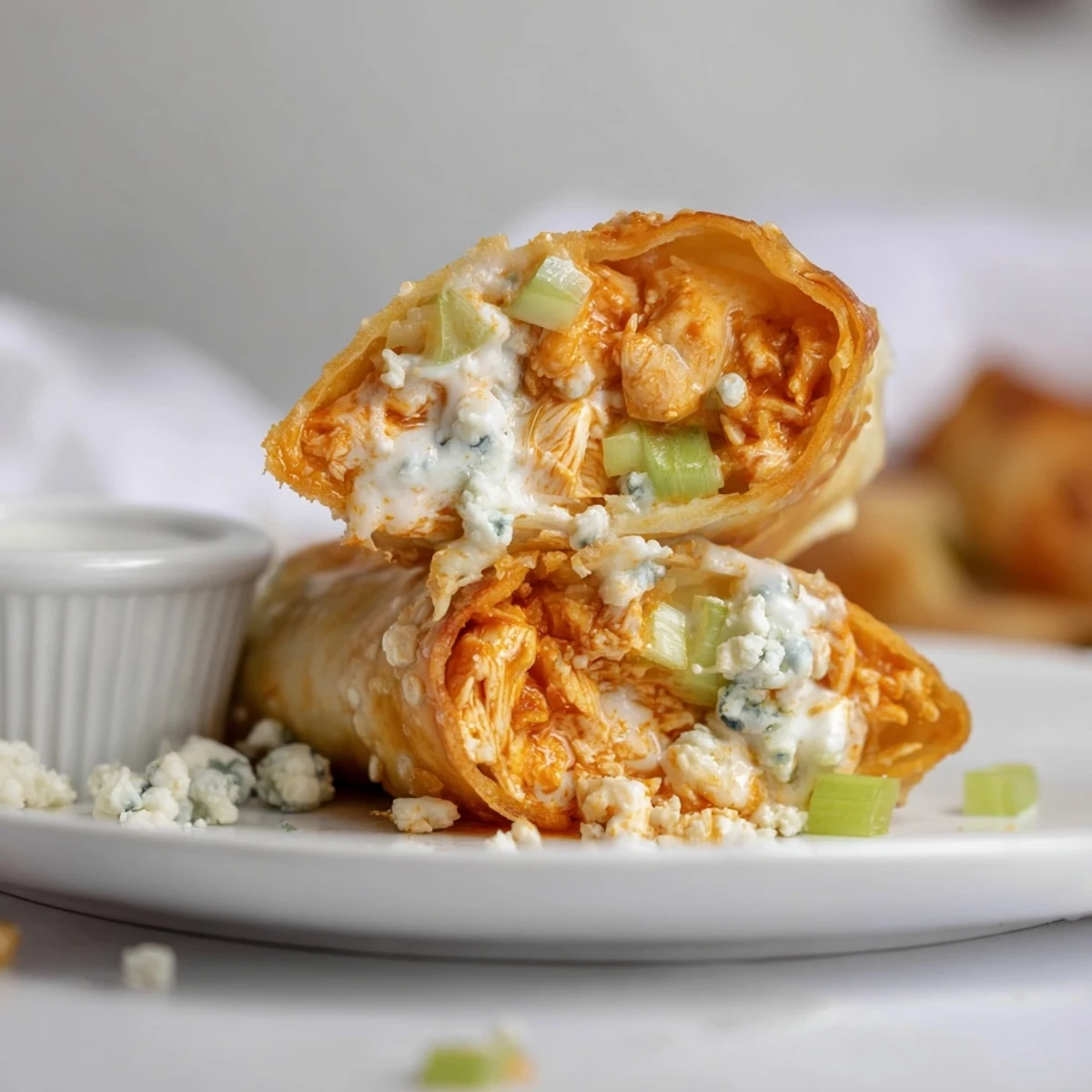 Crispy fried Buffalo Chicken Egg Rolls Recipe served warm with ranch dipping sauce