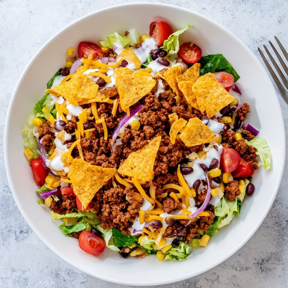Simple Doritos Taco Salad ready in 25 minutes, tangy dressing, zesty crunch