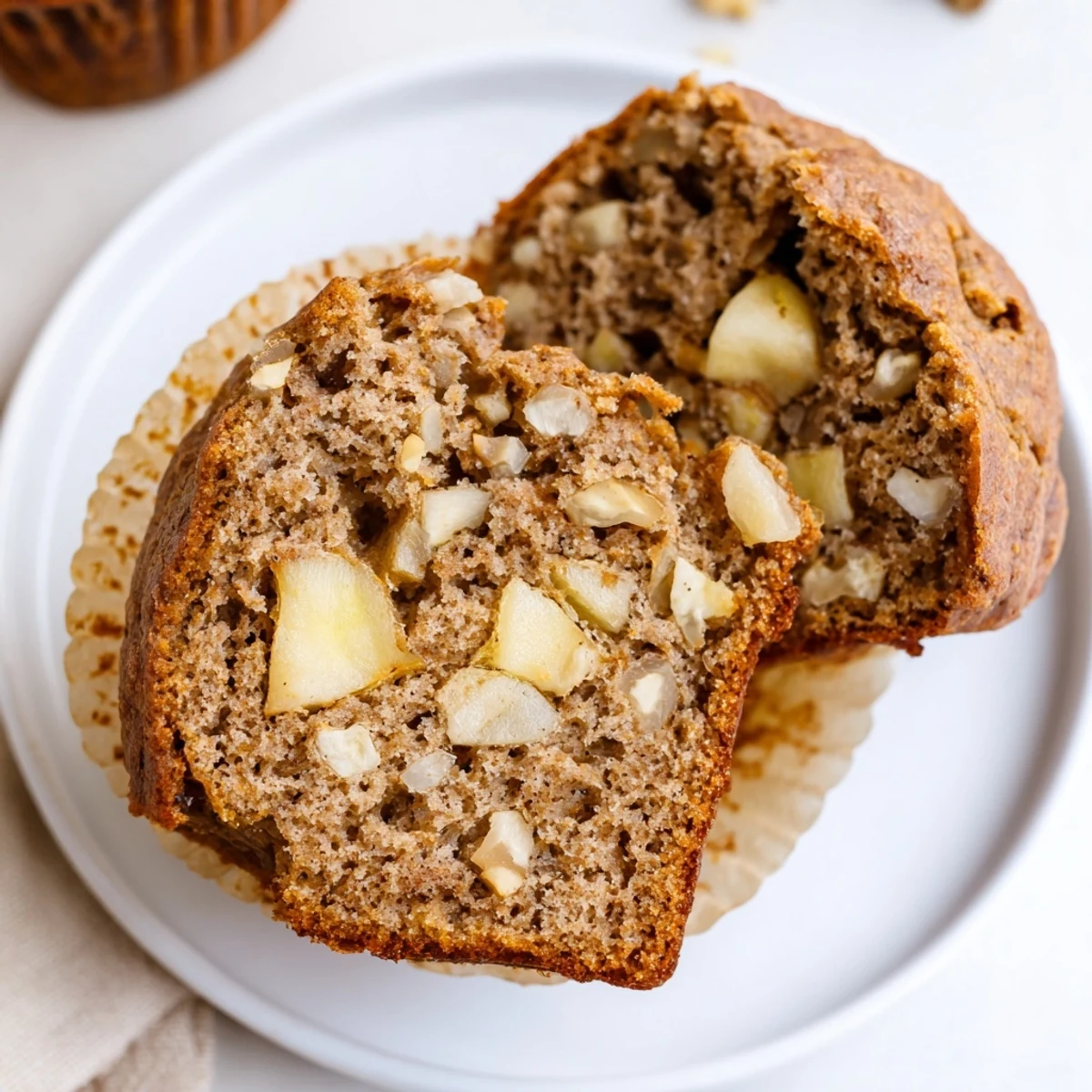 Tender bites with warm spice and apple chunks, Healthy Apple Cinnamon Greek Yogurt Muffins.