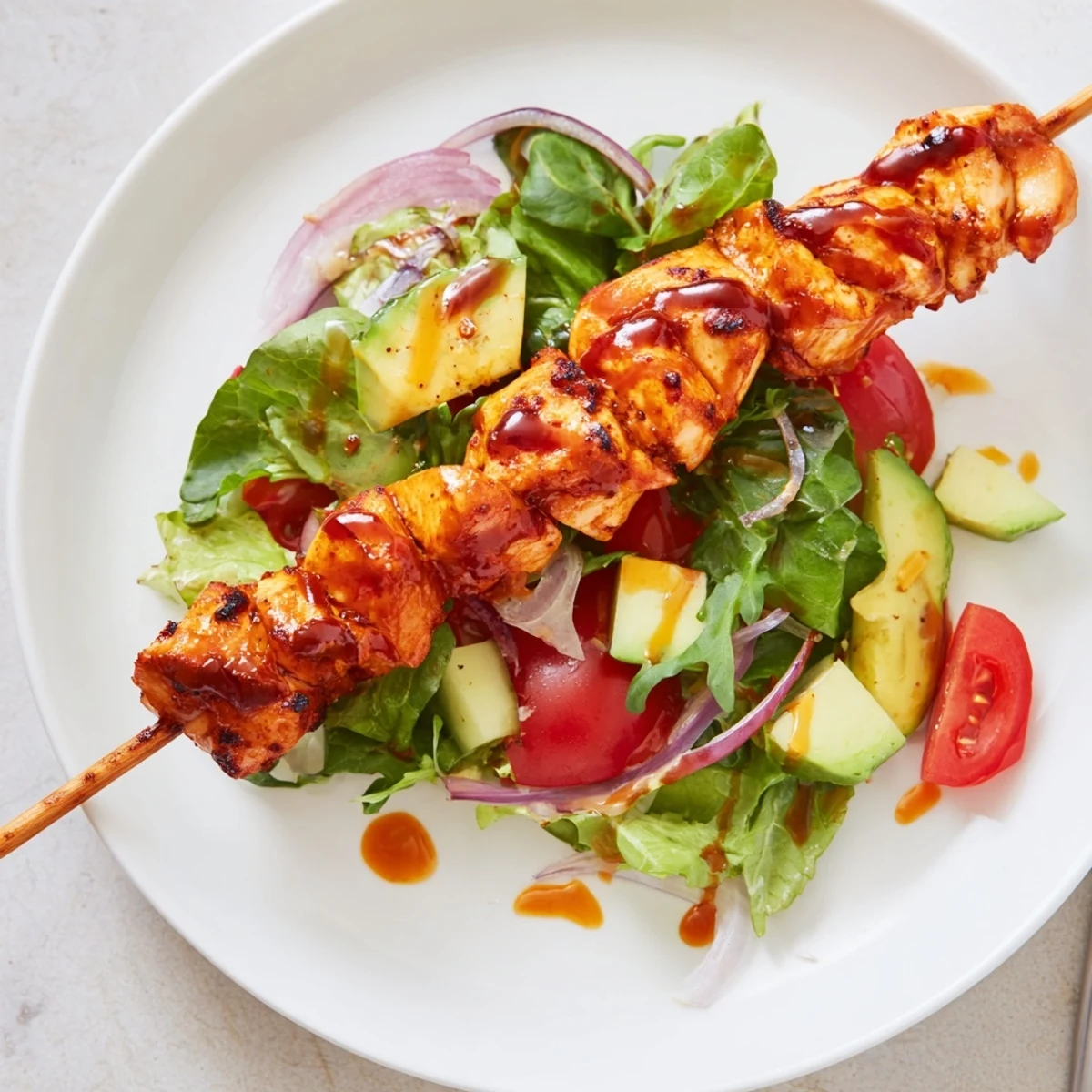 Colorful BBQ Chicken Skewer Salad Recipe on plate, tangy dressing drizzled, summer lunch.