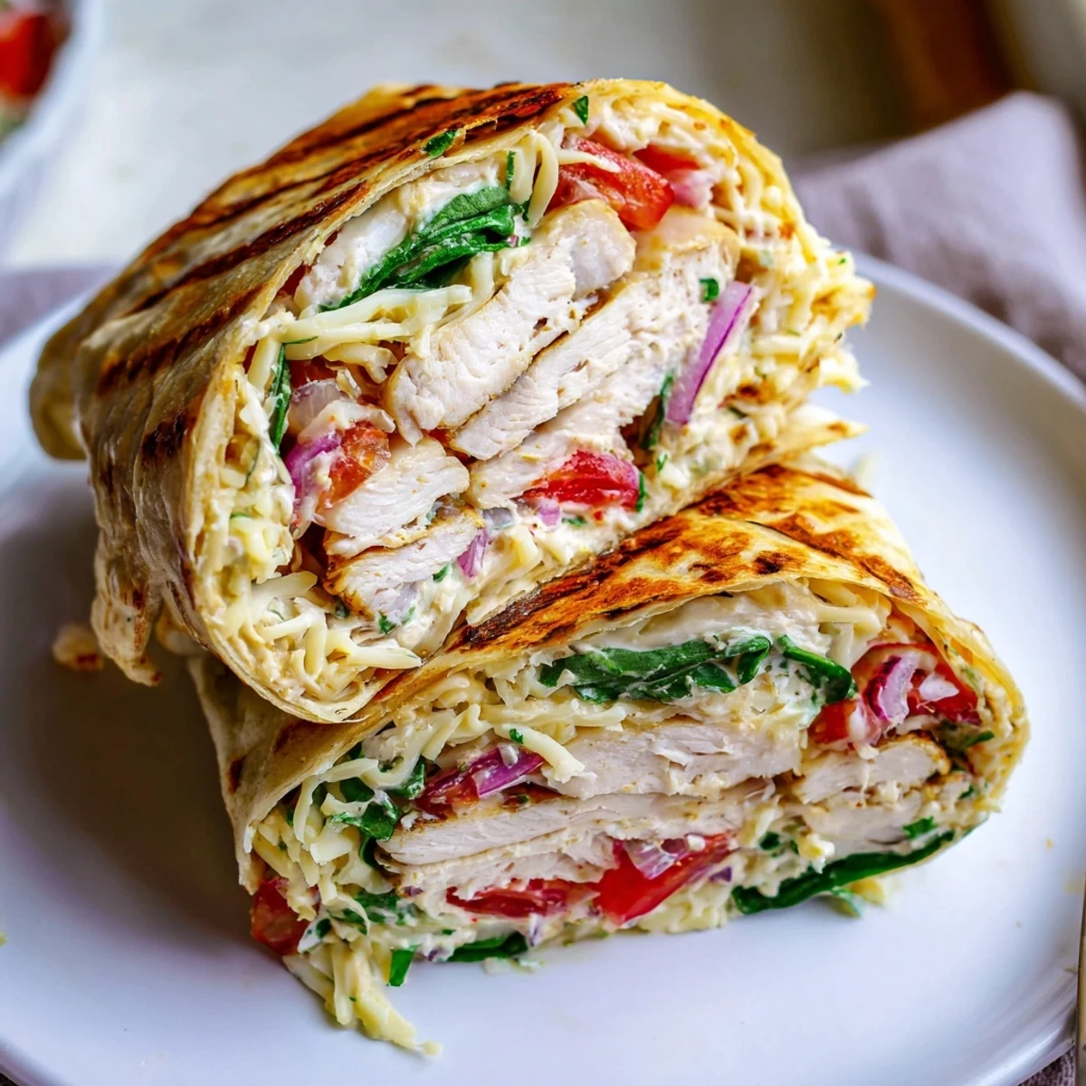 Grilled Cheesy Garlic Chicken Wraps, crisp tortillas charred, spinach and tomato filling