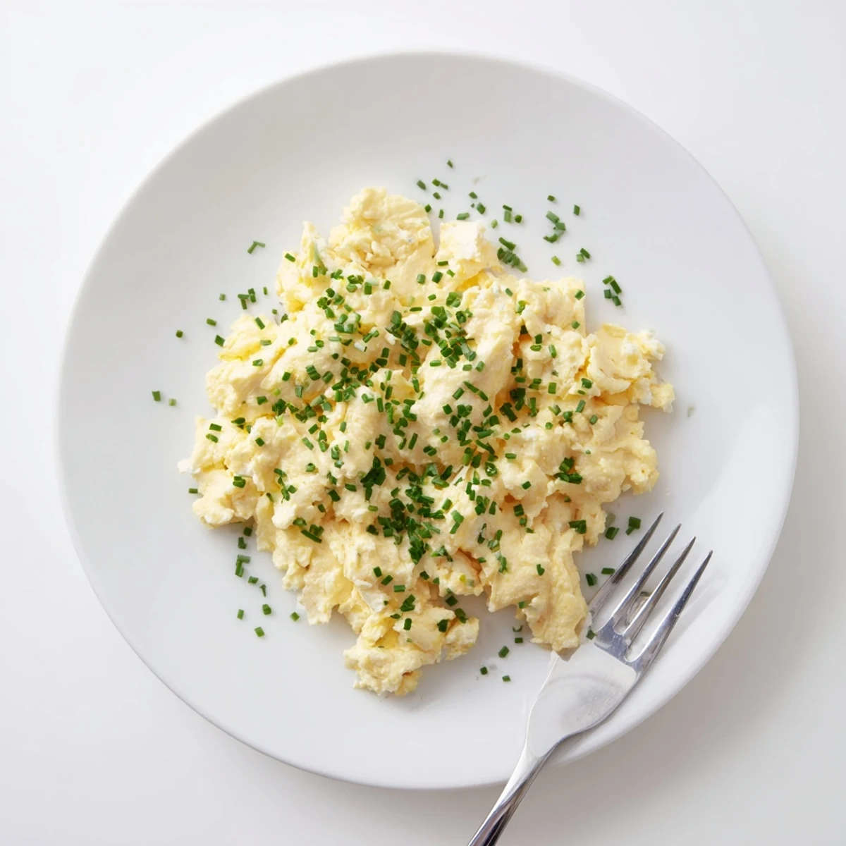 Creamy, fluffy Cottage Cheese Scrambled Eggs with Chives on buttered toast